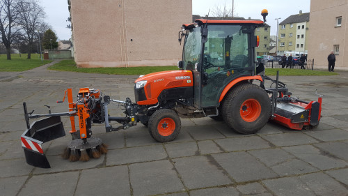 Kersten weed brush attachment be used for integrated weed management on a Kubota B series tractor. Also fitted with a Kersten sweeper with a collector on the rear linkage.