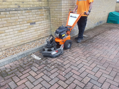 A weed brush may be used to clean block paving without water
